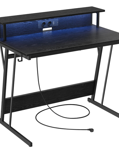 Cargar imagen en el visor de la galería, Mesa de juego VASAGLE con iluminación LED, escritorio con regleta de enchufes incorporada, escritorio para computadora, soporte para 2 monitores, dormitorio
